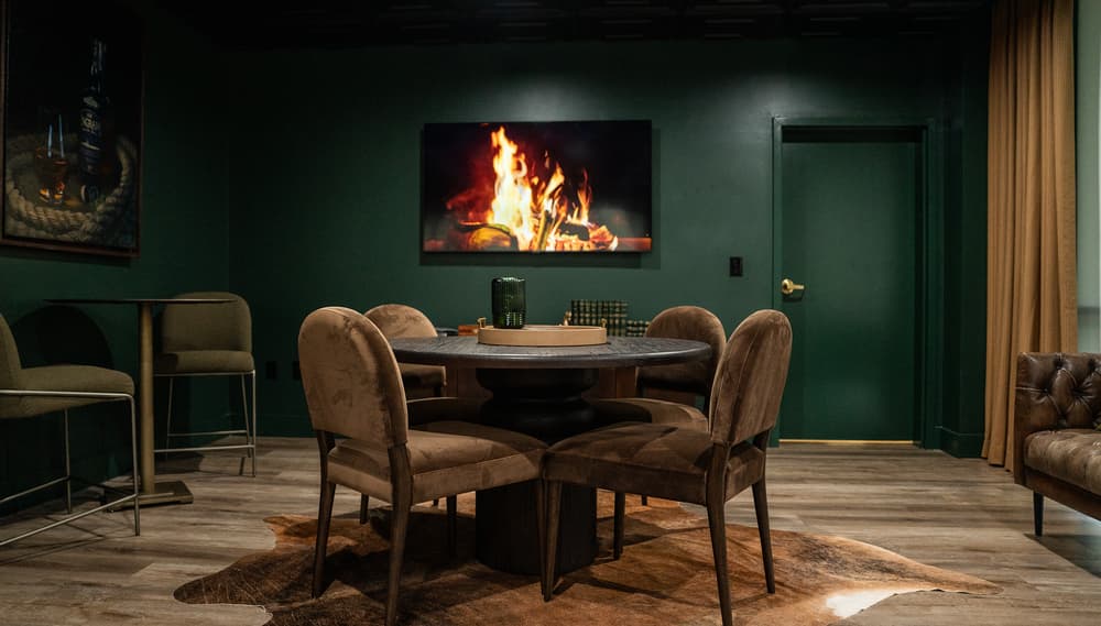 Lounge with a fireplace and dining seating at The Sanctuary