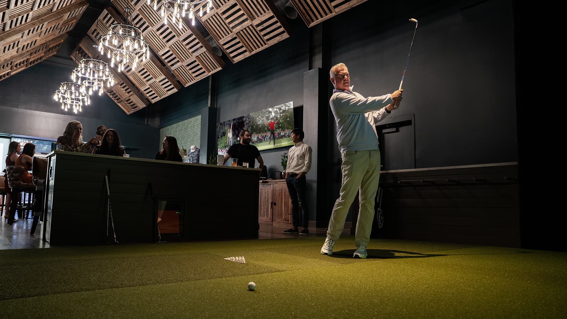 The Sanctuary Brentwood — golf simulator bay with members